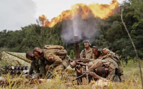 A mortar detachment puts theory into practice at the Nausori Highlands Training Area during Exercise Cartwheel