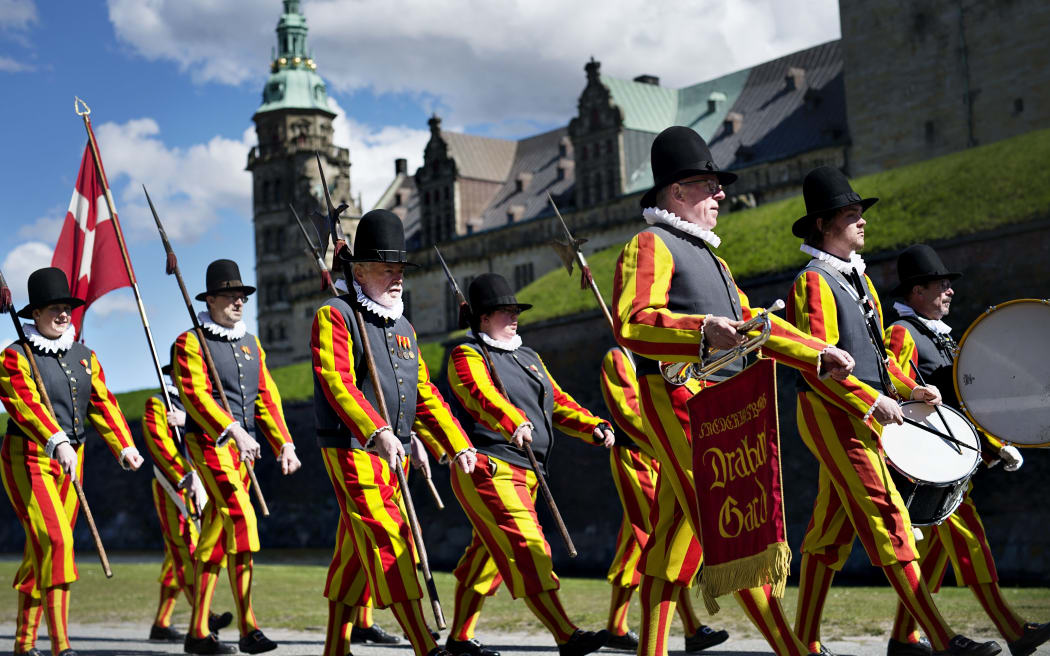 People march in front of Kronborg Castle in Helsingor - the setting of William Shakespeare's Hamlet - to mark the 400th anniversary of the playwright's death.