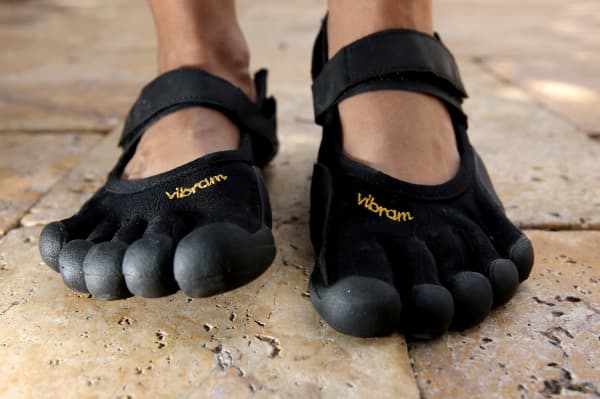 MIAMI, FL - MAY 12: In this photo illustration, a Vibram FiveFinger shoe is seen on May 12, 2014 in Miami, Florida. Vibram FiveFinger announced it would offer refunds to buyers to settle a class action lawsuit that said its health benefit claims went too far. (Photo Illustration by Joe Raedle/Getty Images/AFP (Photo by JOE RAEDLE / GETTY IMAGES NORTH AMERICA / Getty Images via AFP)