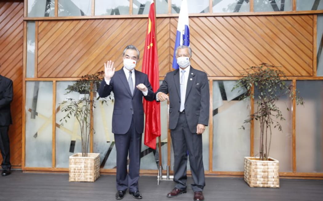 Former Foreign Minister of China Wang Yi, left, with Pacific Islands Forum secretary-general Henry Puna.