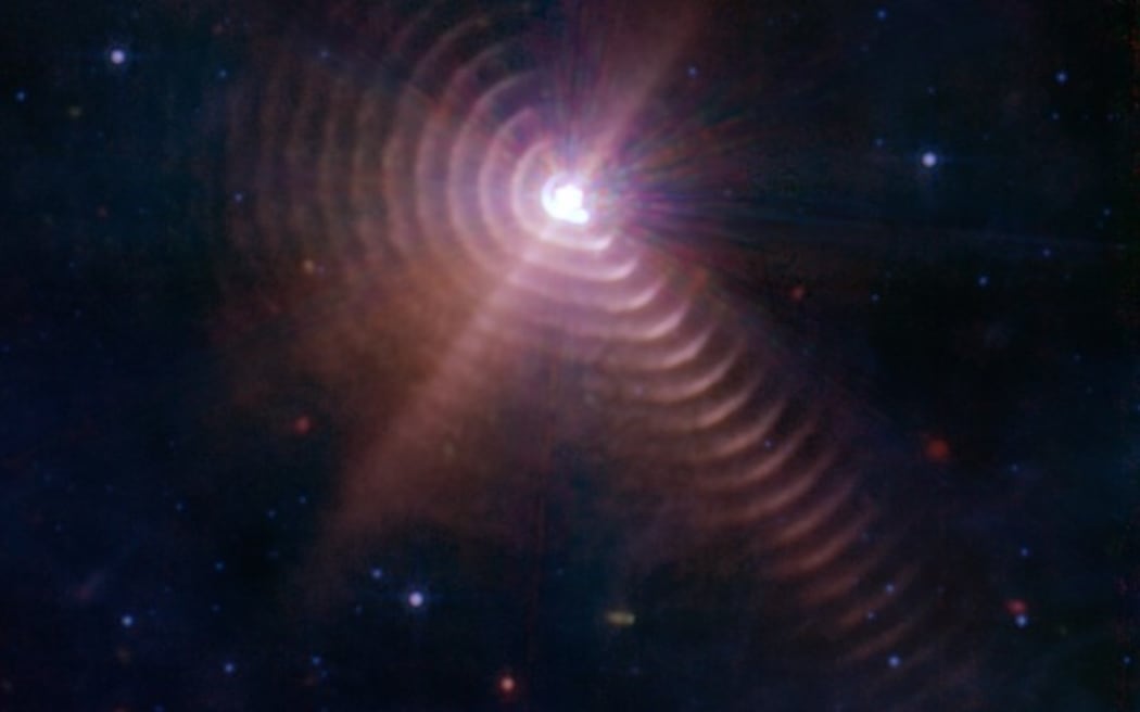 Image of WR140 binary taken by NASA’s James Webb Space Telescope with the puzzling concentric rings