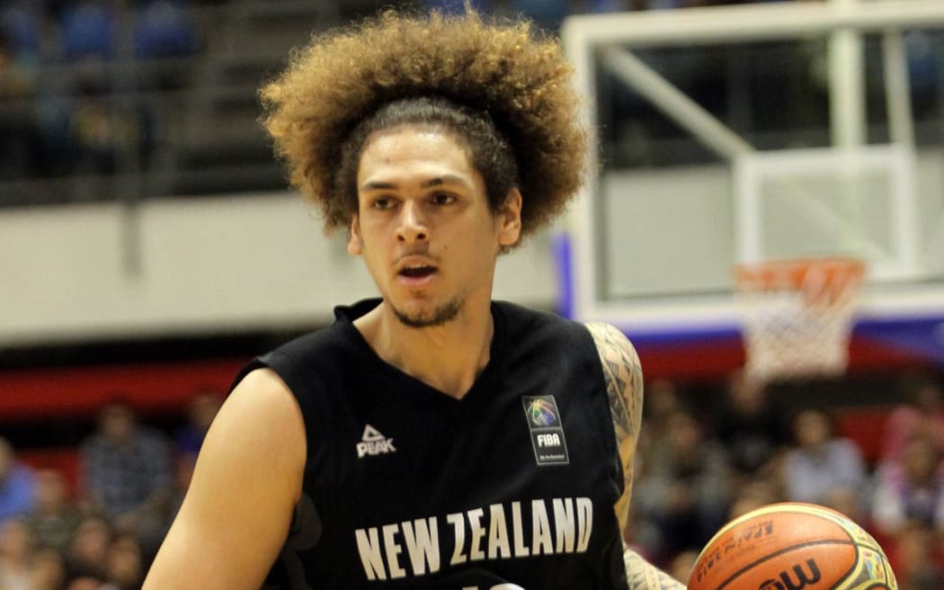 The Tall Blacks forward Isaac Fotu in action.