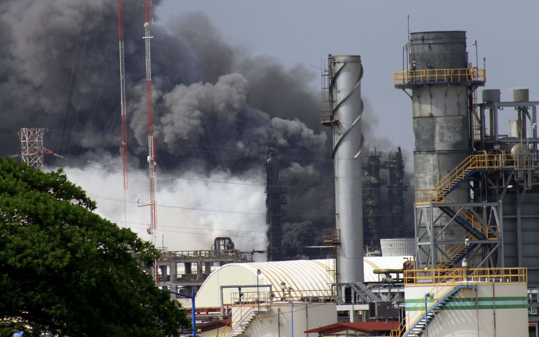 Military personnel take care of the first injured workers after an explosion at the Pajaritos PEMEX petrochemical plant in Coatzacoalcos, Veracruz state, Mexico
