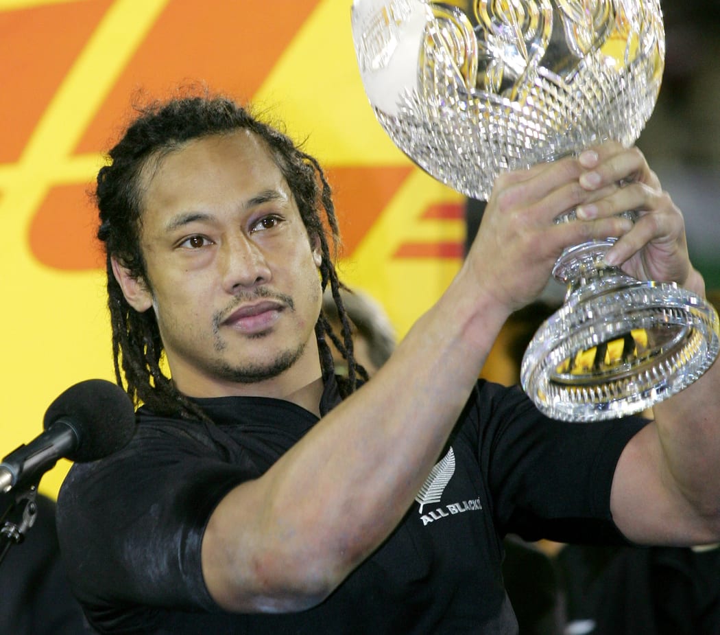New Zealand All Blacks captain Tana Umaga holds the trophy aloft after they defeated the British and Irish Lions in the third Test match in Auckland, 09 July 2005.