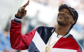 US rapper and sports commentator for US broadcaster NBC, Snoop Dogg gives the start of the Women's Breaking dance competition during the Paris 2024 Olympic Games at La Concorde in Paris, on August 9, 2024. (Photo by Odd ANDERSEN / AFP)