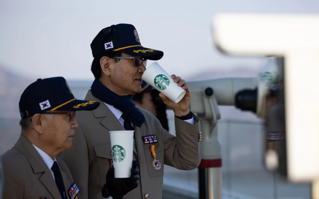 South Korean veterans drink coffee at an observation deck of the Starbucks Coffee in Gimpo.