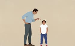 A dad or parenting yelling and pointing a finger at their child son.