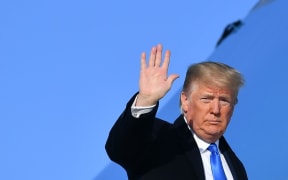 US President Donald Trump makes his way to board Air Force One before departing from Andrews Air Force Base in Maryland on December 7, 2019.