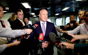 Prime Minister Christopher Luxon speaks to media on navy ship HMNZS Te Kaha in India on 20 March 2025.