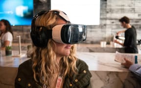 A woman using a VR headset at SXSW, 2015.