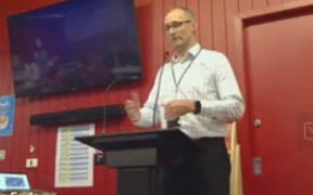 Darron Monaghan, general manager capital works at the Ministry of Education, speaks to a meeting of Wellington Girls’ College staff and families on 13 August about the quake risks and shutdown at its largest teaching block.