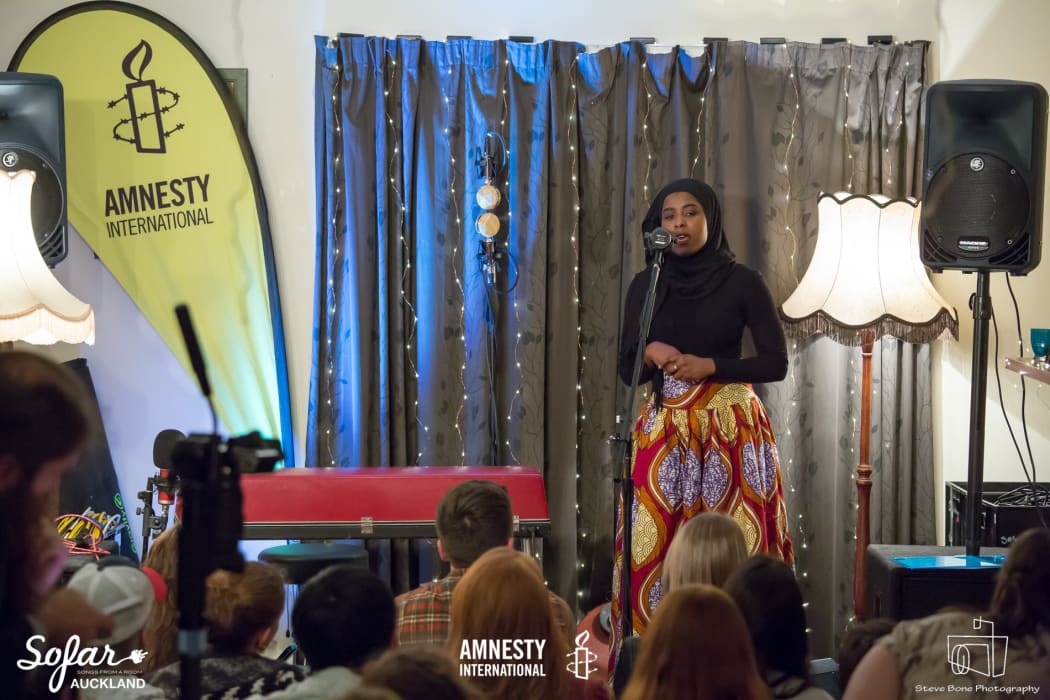 Fatumata Bah speaks at the giveahome concert in Auckland