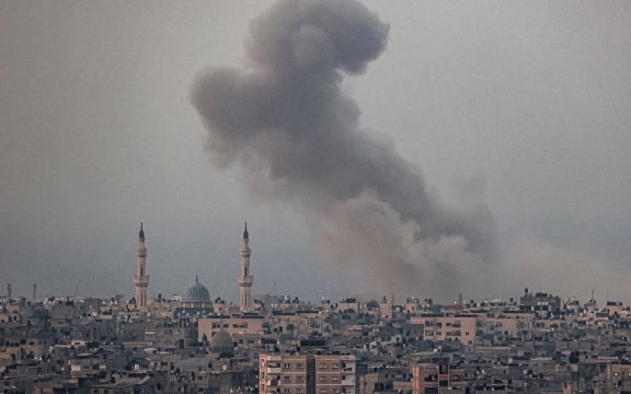 A smoke plume billows after Israeli bombardment in Rafah in the southern of Gaza Strip on October 28, 2023 amid the ongoing battles between Israel and the Palestinian group Hamas. (Photo by SAID KHATIB / AFP)