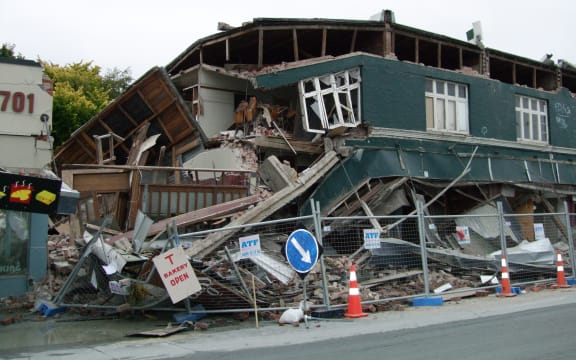 A photo taken on February 22, 2011 shows a collapsed row of shops on Worcester Street in Christchurch.