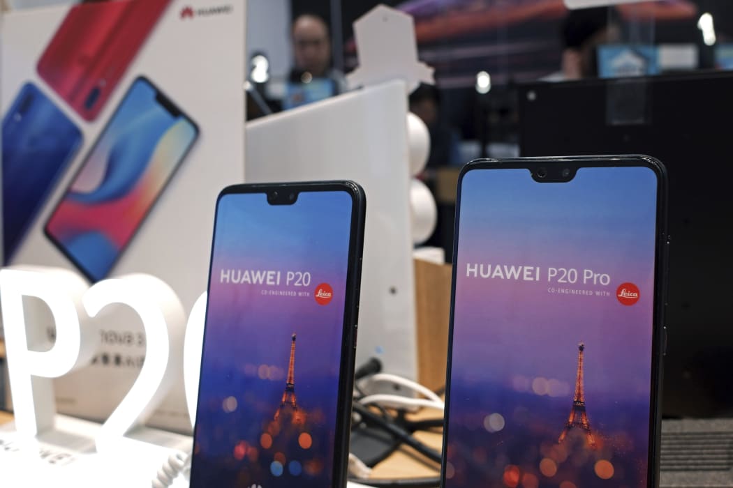 Huawei's mobile phones are displayed at a telecoms service shop in Hong Kong, Friday, March 29, 2019.