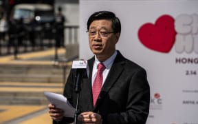 Hong Kong Chief Executive John Lee is speaking at the Chubby Hearts Kick Off Ceremony in Hong Kong, on February 14, 2024. The Chubby Hearts Project by artist Anya Hindmarch is being displayed around Hong Kong, with the largest one in Central. (Photo by Vernon Yuen/NurPhoto) (Photo by Vernon Yuen / NurPhoto / NurPhoto via AFP)