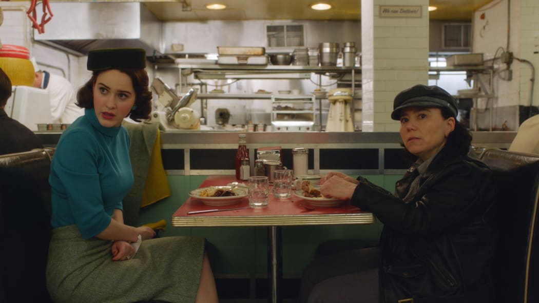 Midge (Rachel Brosnahan) and Susie (Alex Borstein) nosh and schmooze in season two of Amazon’s The Marvelous Mrs. Maisel.