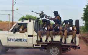 A picture take on 30 October 2018 shows Burkinabe gendarmes sitting on their vehicle in the city of Ouhigouya in the north of the country.