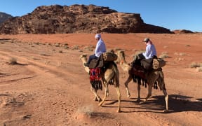 Andrew Bayly and his son Dan on camels.