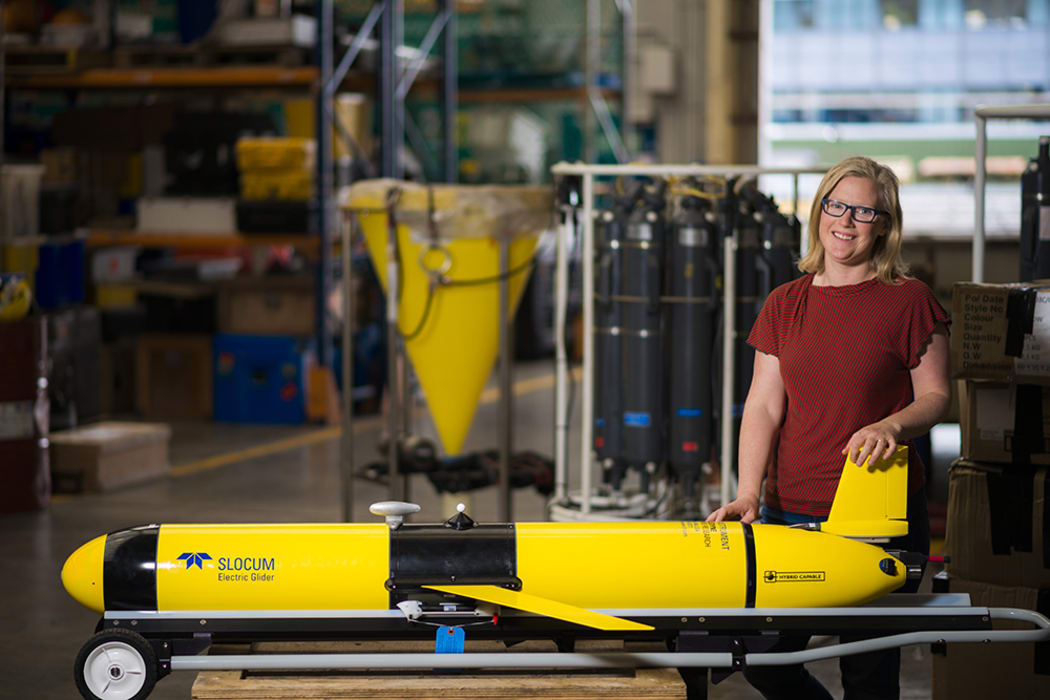 Oceanographer Joanne O'Callaghan stands next to NIWA's new Slocum Glider.