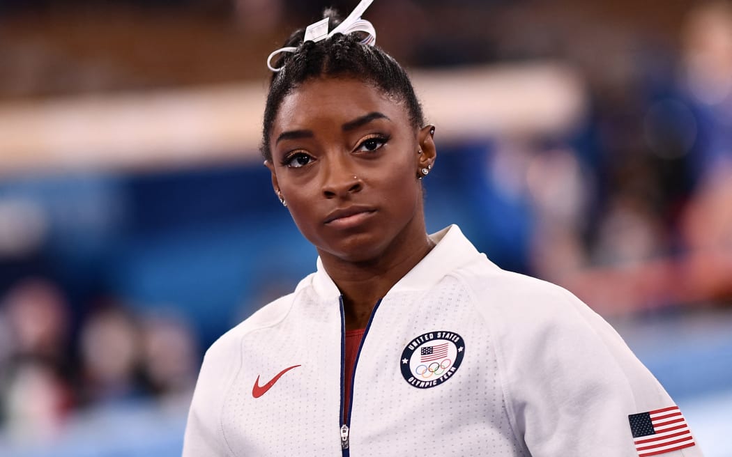 USA's Simone Biles waits for the final results of the artistic gymnastics women's team final during the Tokyo 2020 Olympic Games at the Ariake Gymnastics Centre in Tokyo on July 27, 2021. (Photo by Loic VENANCE / AFP)
