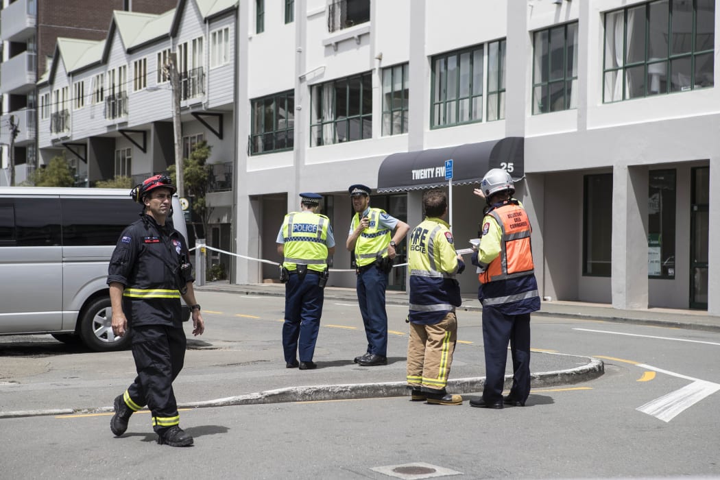 Emergency service outside Tennyson Apartments on Tennyson St, Wellington.  The apartments have been evacuated because of structural damage.