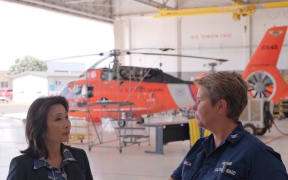 Captain Jennifer Conklin (standing right) sharing her knowledge on humanitarian responses.