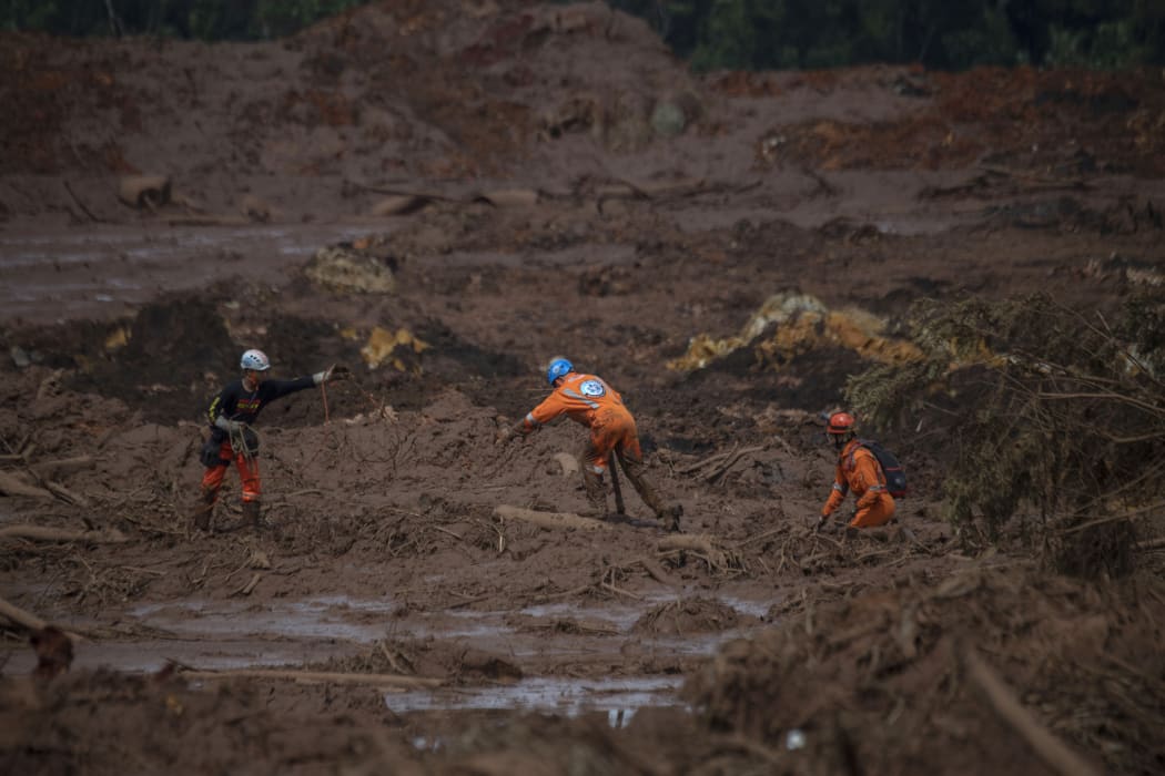 Rescuers search for vicitms in the mud-hit community of Casa Grande two days after the collapse of a dam at an iron-ore mine belonging to Brazil's giant mining company Vale near the town of Brumadinho, state of Minas Gerias, southeastern Brazil, on January 27, 2019.
