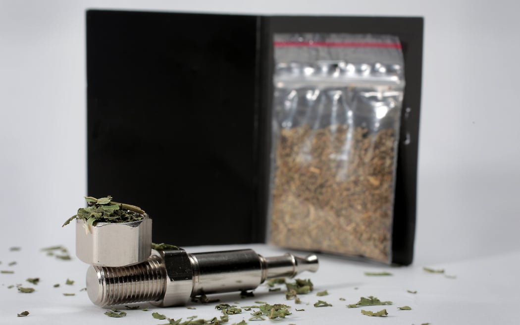 Synthetic cannabis and a pipe.