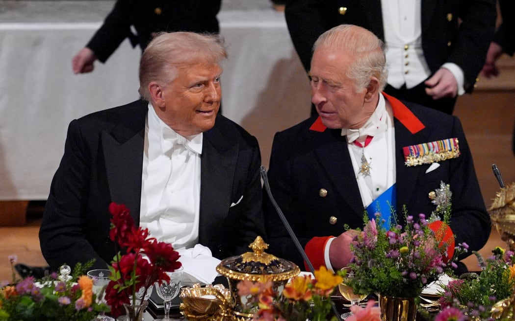 US President Donald Trump and Britain's King Charles III attend a State Banquet at Windsor Castle, in Windsor, on September 17, 2025, during the US President's second State Visit. US President Donald Trump arrived in Britain for an unprecedented second State Visit, with the UK government rolling out a royal red carpet welcome to win over the mercurial leader. (Photo by Yui Mok / POOL / AFP)