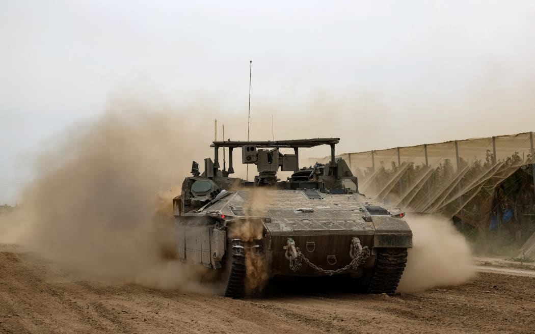 An Israeli tank rolls along the border with the Gaza Strip on February 23, 2024, amid ongoing battles between Israel and Hamas.