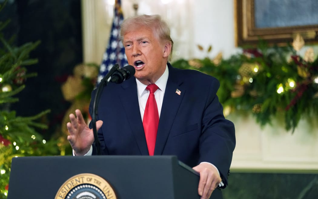 US President Donald Trump addresses the nation from the Diplomatic Reception Room of the White House in Washington, DC, on December 17, 2025. (Photo by Doug MILLS / POOL / AFP)