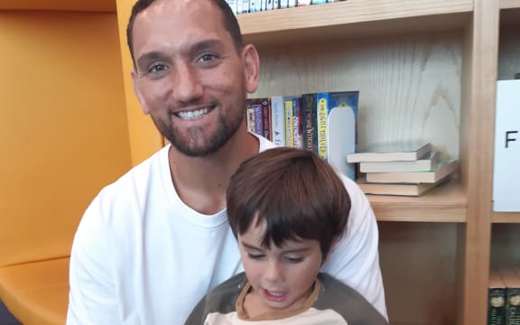 Former All Black Aaron Cruden with son Cooper aged 4 enjoy Wriggle and Rhyme at Te Kete Aronui Rototuna Library in Hamilton.