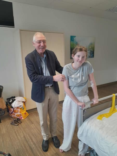 Standing for the first time in 18 months with surgeon Wilhelm Sandmann.