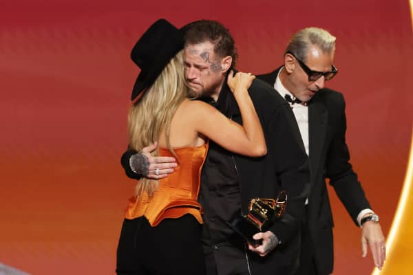 Jelly Roll (C) accepts the Best Contemporary Country Album award for "Beautifully Broken" from Lainey Wilson (L) and Jeff Goldblum (R) onstage during the 68th GRAMMY Awards at Crypto.com Arena on February 01, 2026 in Los Angeles, California.