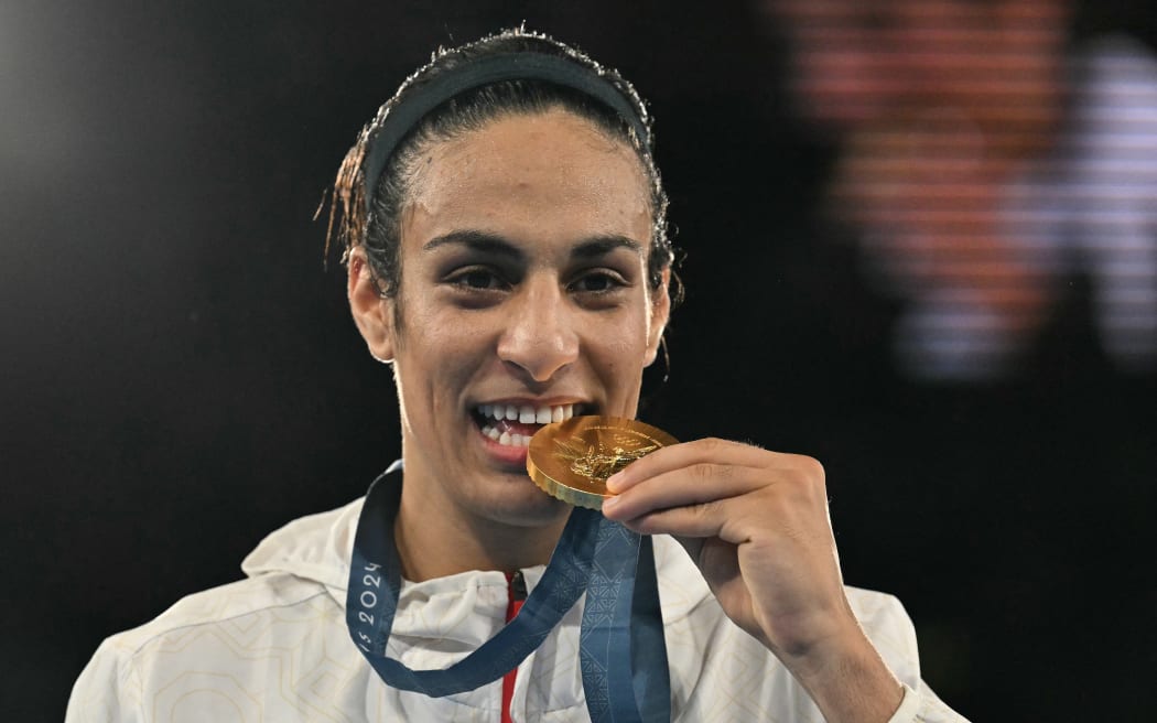 Boxing gold medallist Algeria's Imane Khelif poses on the podium
