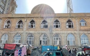 The Seh Dokan mosque stands in a busy area of Mazar-i-Sharif, a city in northern Afghanistan.