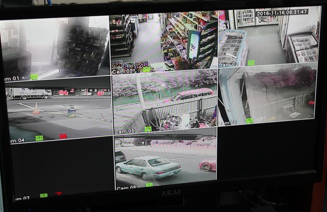 A photo of several different screens. These show CCTV footage of Kamlesh Patel's store taken from security cameras