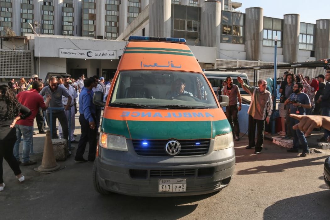 An ambulance transporting wounded Egyptians arrives at a hospital in Cairo's northern suburb of Shubra on May 26, 2017, following an attack in which 28 Coptic pilgirms were gunned down following a visit to a monastery.