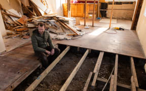 Warren Fitzgerald looking at the uncompleted work at his property