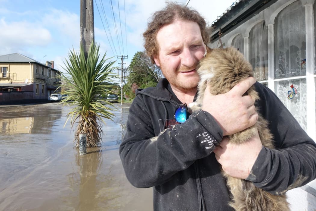 Aaron Fitton and his cat Iggy.