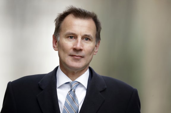 FILE - In this Wednesday, March 13, 2019 file photo, Britain's Foreign Secretary Jeremy Hunt arrives for a cabinet meeting at 10 Downing Street in London.