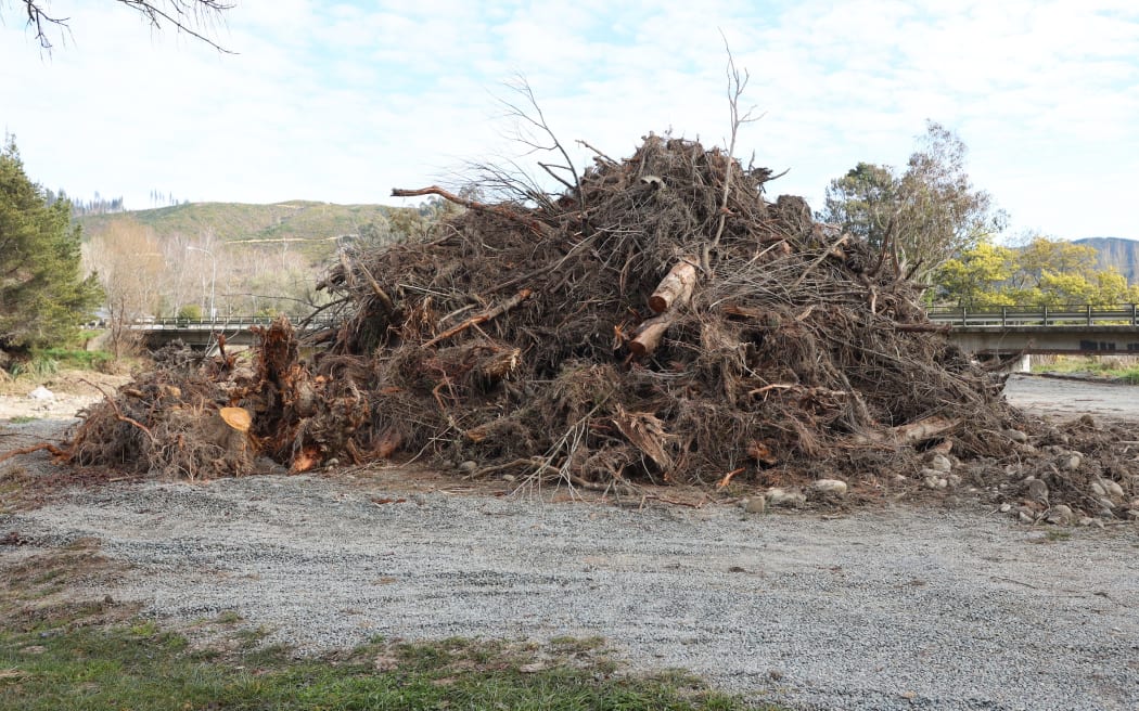 Tasman District Council has piled woody debris pulled from the Wai-iti River beside State Highway 6.