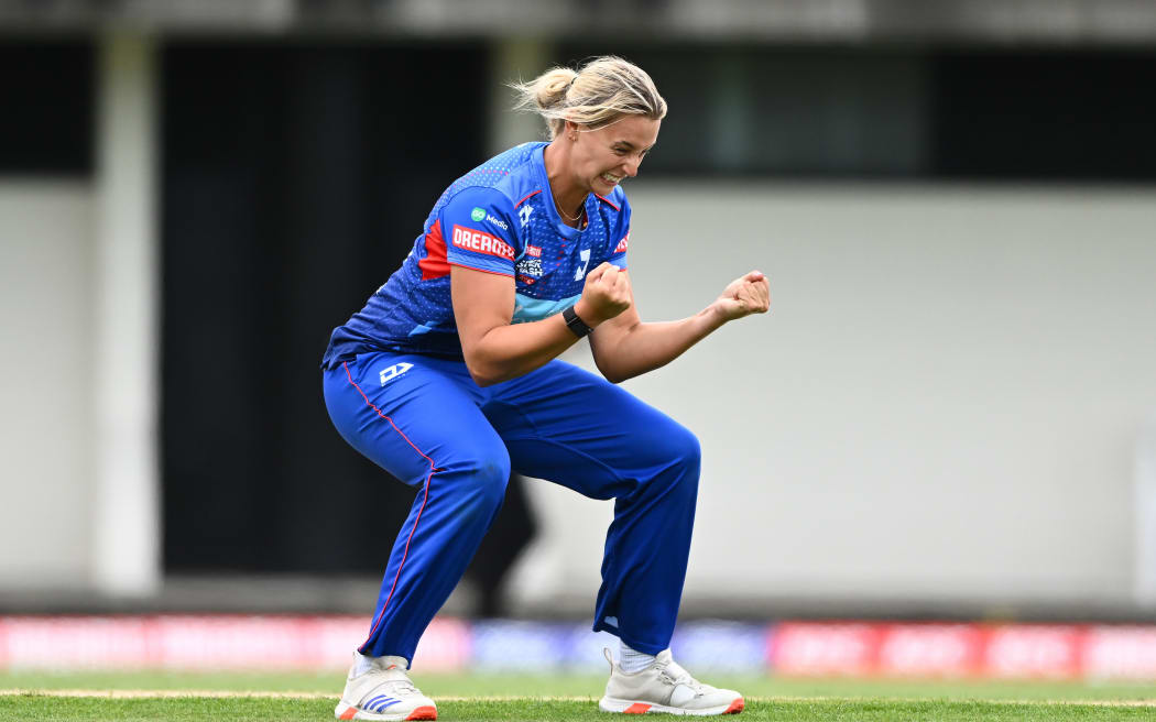 Auckland Hearts Molly Penfold celebrates a wicket.