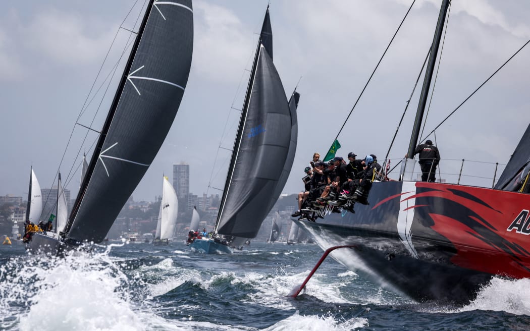 Yacht Andoo Comanche (R) competes during the start of the annual Sydney to Hobart yacht race on Boxing Day at Sydney Harbour on December 26, 2023.