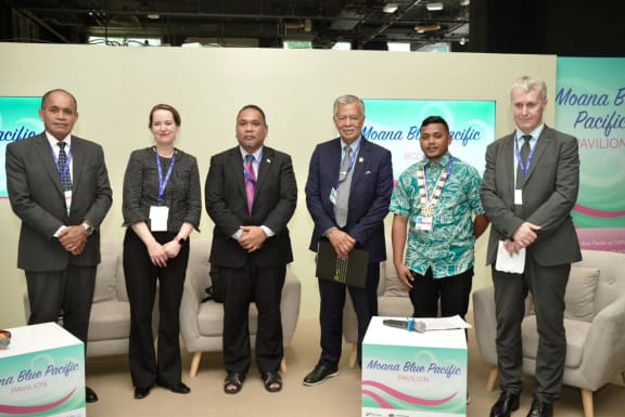 Speaking to island representatives in Dubai Saturday night, Henry Puna, third from right, said his message was "let's not lose hope".