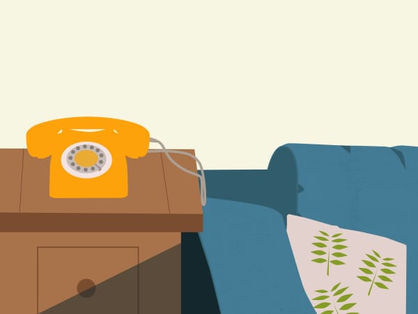 An illustration of a yellow telephone on a side table alongside a blue sofa.