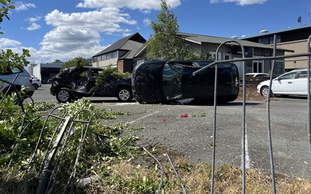 An accident at the Hamilton Radiology carpark left a car on its side.