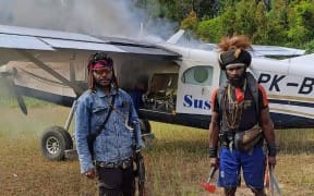 West Papua Liberation Army rebels torch the plane that Phillip Mehrtens was piloting