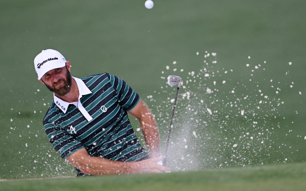 AUGUSTA, GEORGIA - APRIL 05: Dustin Johnson of the United States plays a shot from a bunker on the second hole during a practice round prior to the 2023 Masters Tournament at Augusta National Golf Club on April 05, 2023 in Augusta, Georgia.   Ross Kinnaird/Getty Images/AFP (Photo by ROSS KINNAIRD / GETTY IMAGES NORTH AMERICA / Getty Images via AFP)